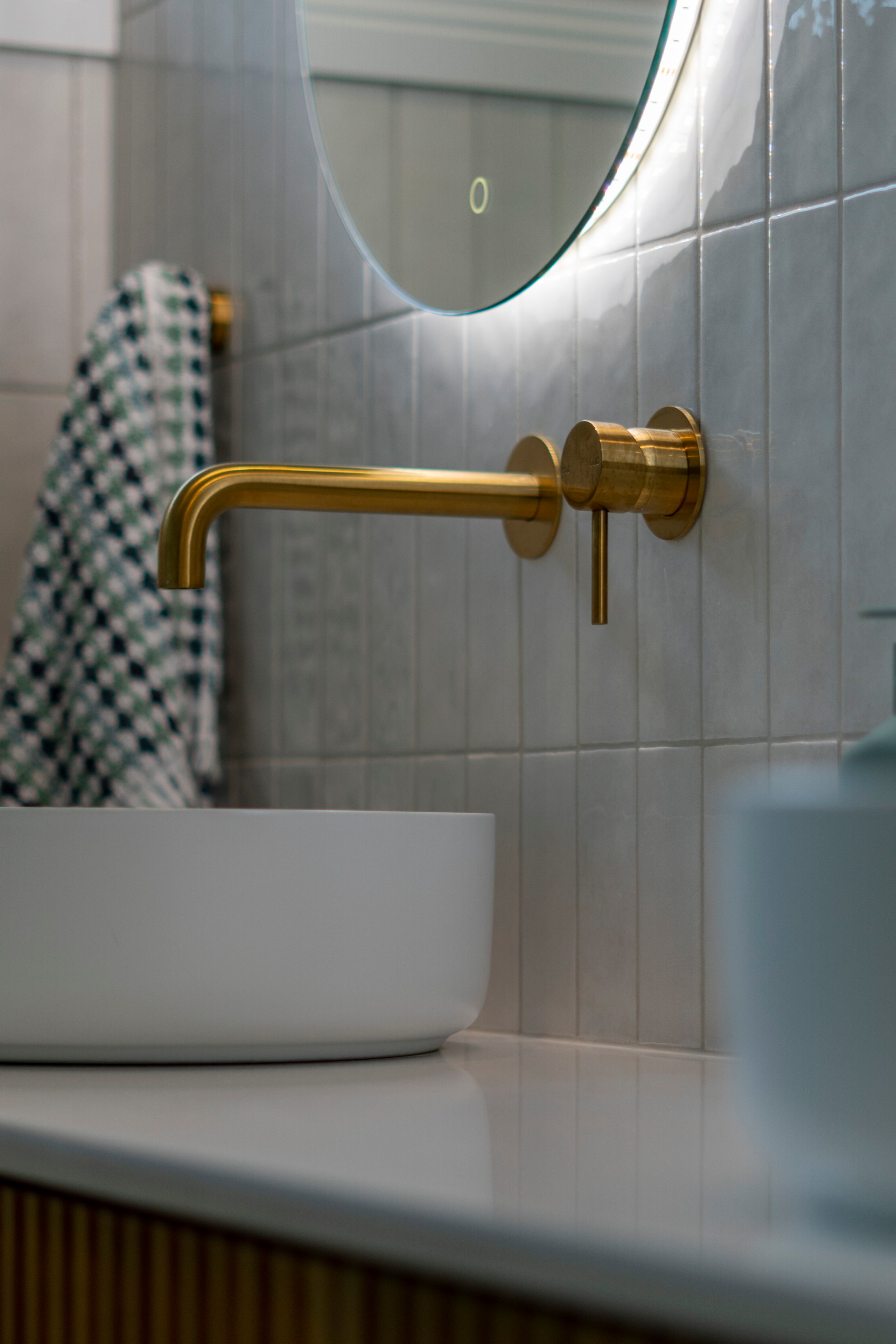 Modern bathroom sink with gold faucet