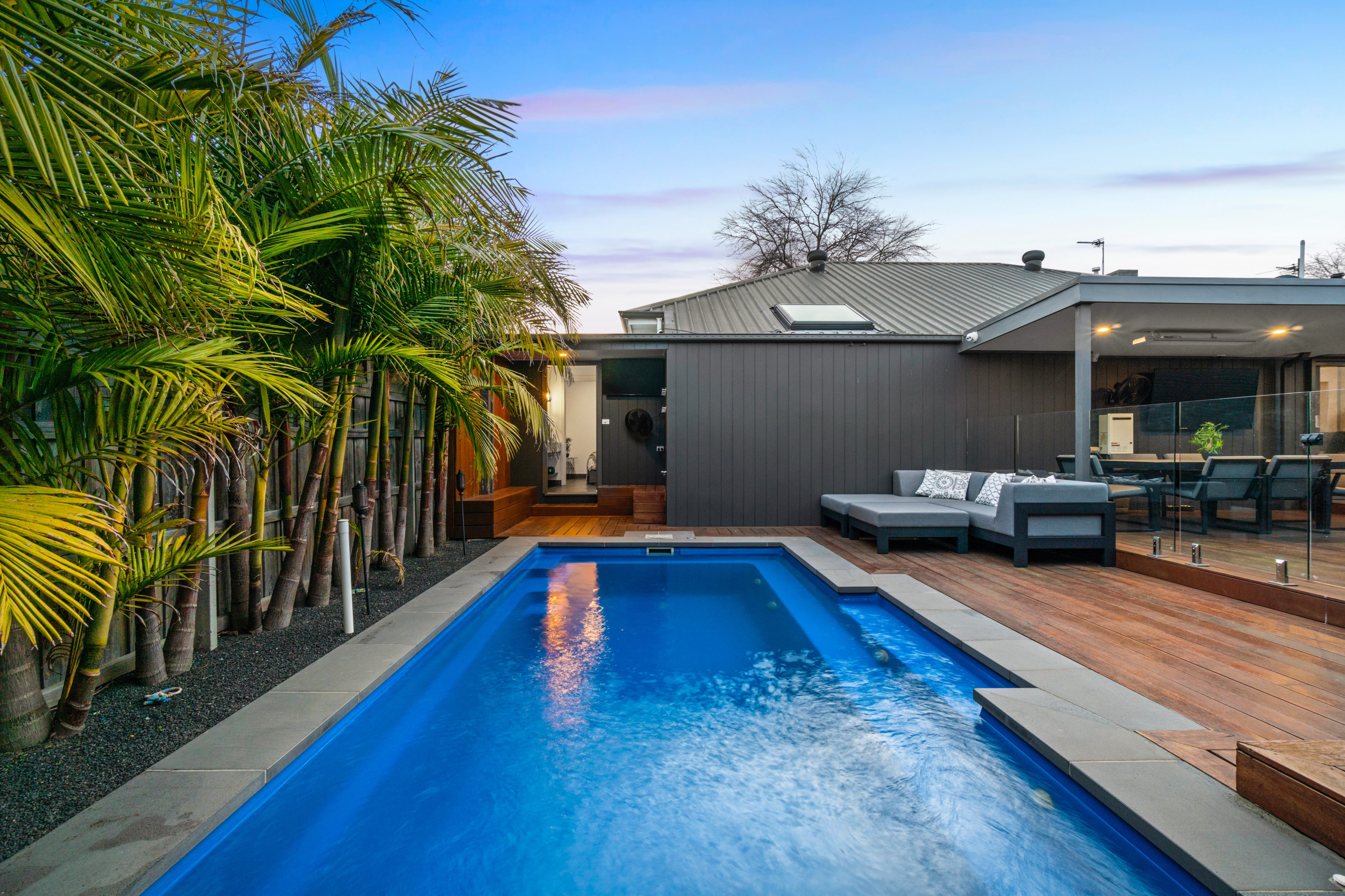 Modern backyard pool and entertaining area