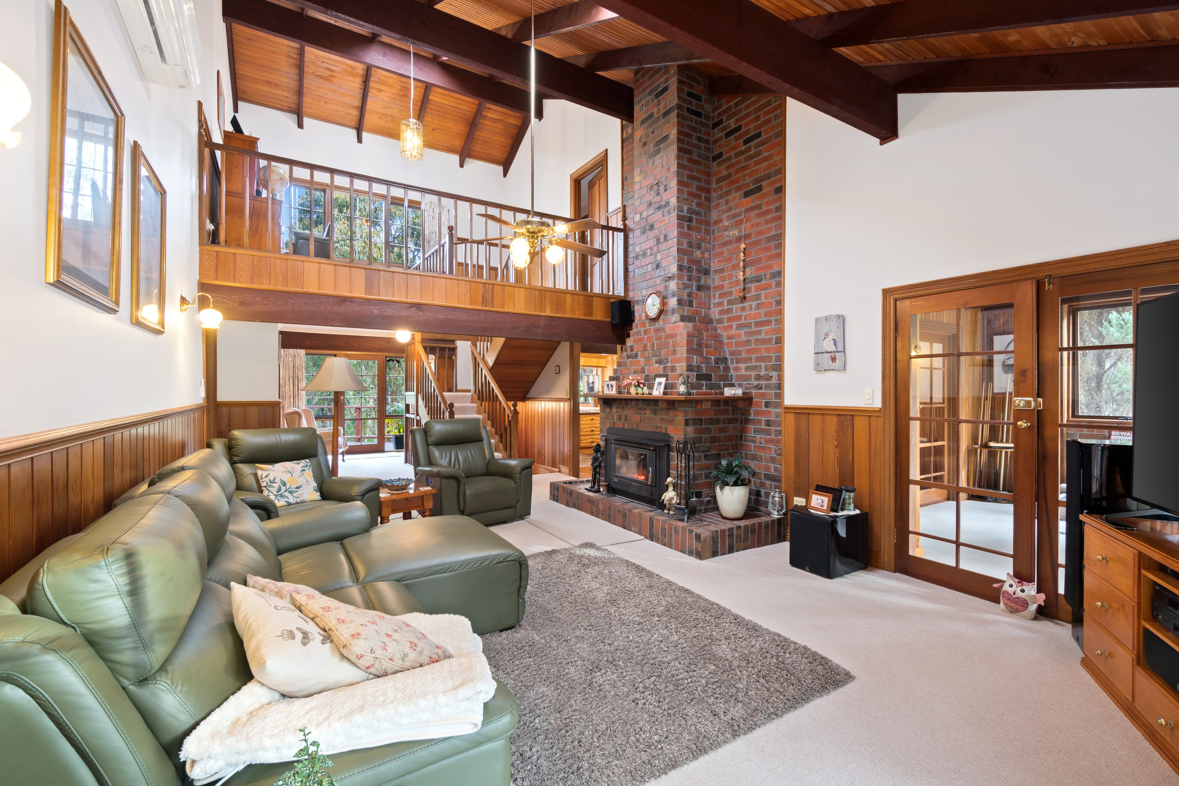 Spacious living room with brick fireplace